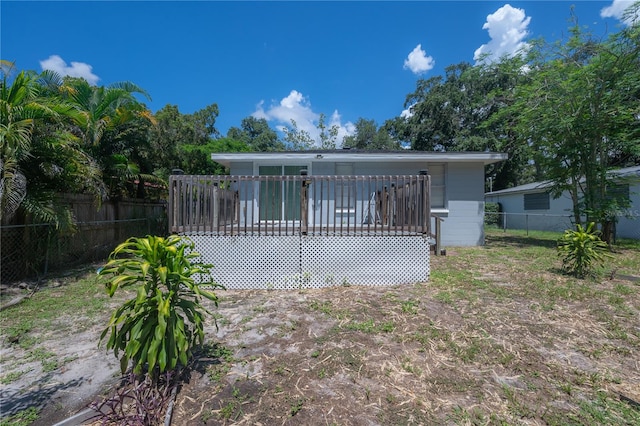 back of property with a deck