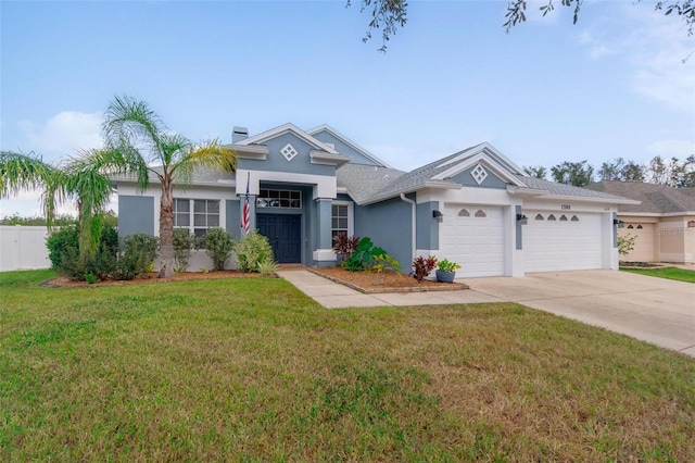 view of front of home featuring a front lawn and a garage