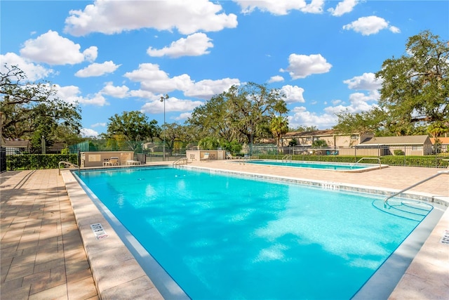 view of swimming pool featuring a patio area