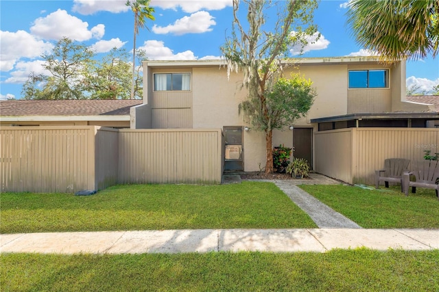 view of front of property with a front lawn