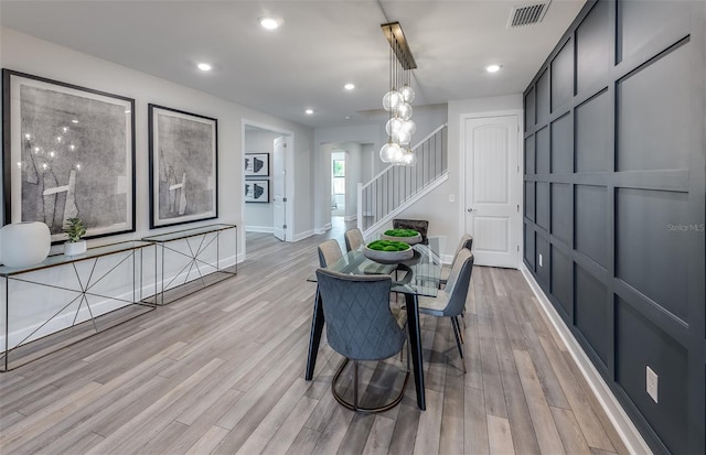 dining space featuring light wood-type flooring