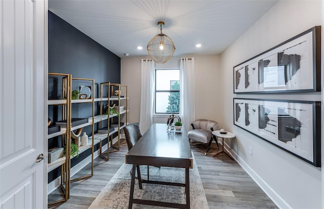 office area featuring hardwood / wood-style flooring and a chandelier