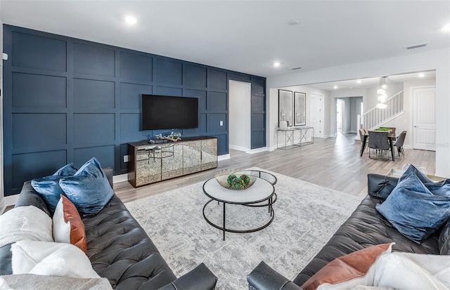 living room with light hardwood / wood-style flooring