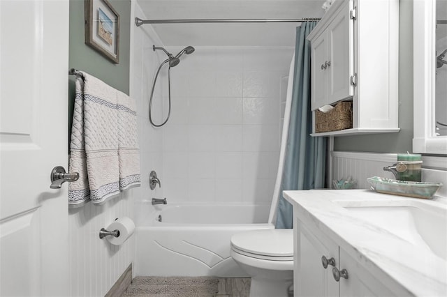 full bathroom featuring toilet, shower / tub combo, and vanity