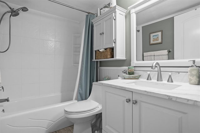 full bathroom with vanity, shower / bath combo, and toilet