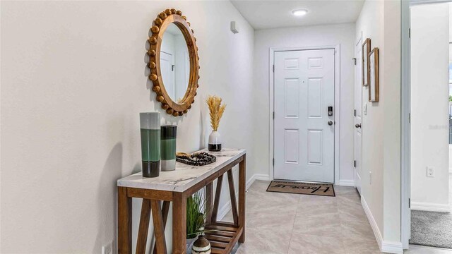 foyer entrance featuring light tile patterned floors