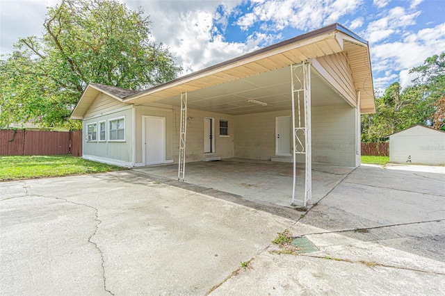 view of parking / parking lot with a carport