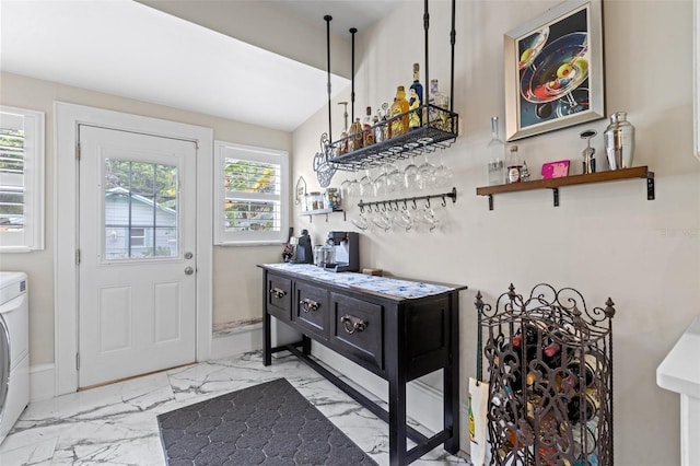 foyer with bar and washer / dryer