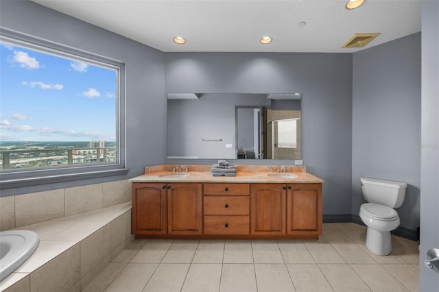 full bathroom with tile patterned flooring, vanity, toilet, and plus walk in shower