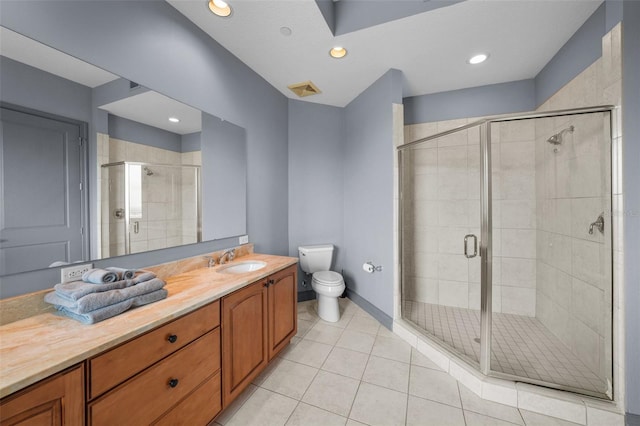 bathroom with toilet, an enclosed shower, vanity, and tile patterned floors