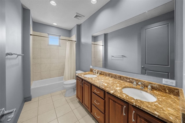 full bathroom featuring vanity, shower / bath combo, tile patterned flooring, and toilet