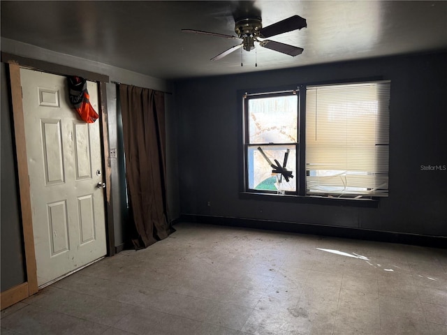 empty room featuring ceiling fan