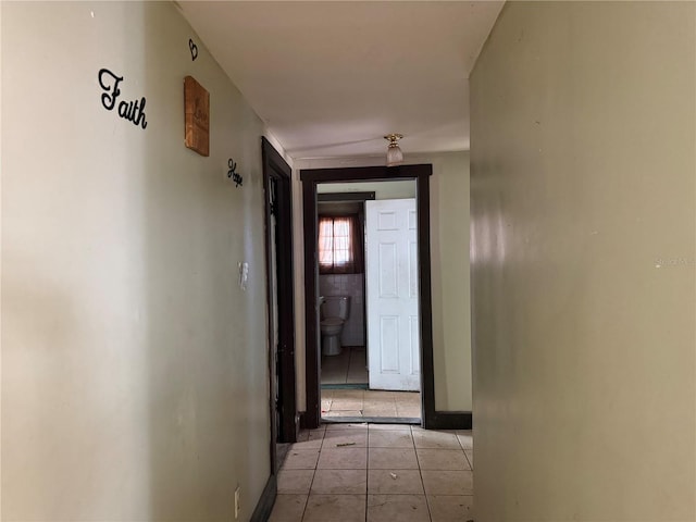 hallway featuring light tile patterned floors