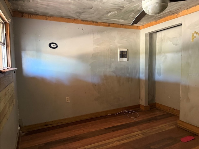 unfurnished room with dark hardwood / wood-style floors