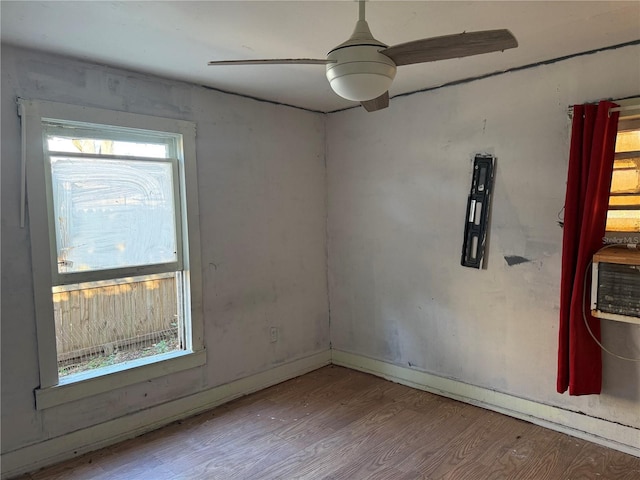 empty room featuring ceiling fan and light wood-type flooring