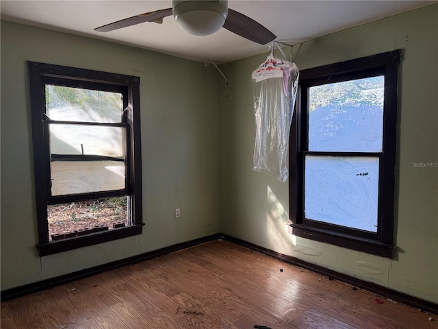 empty room featuring hardwood / wood-style floors and ceiling fan