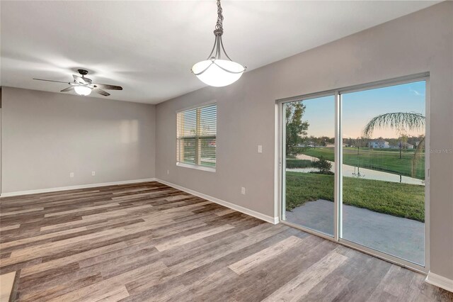 spare room featuring hardwood / wood-style floors and ceiling fan