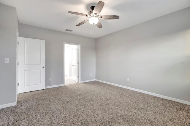 carpeted empty room with ceiling fan