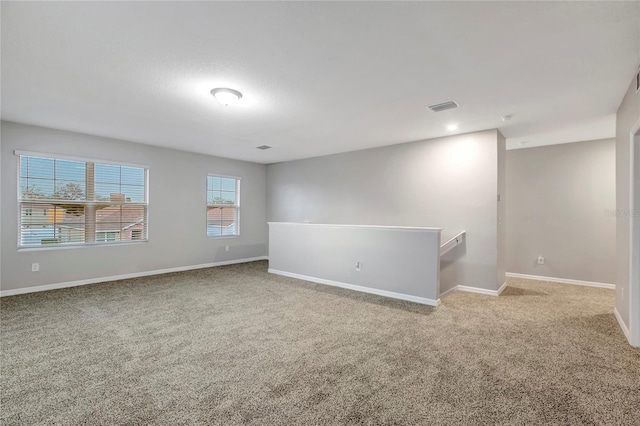 empty room with carpet flooring