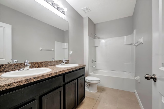 full bathroom with toilet, vanity, tiled shower / bath, and tile patterned flooring