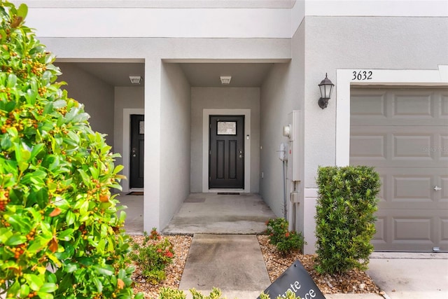 property entrance with a garage