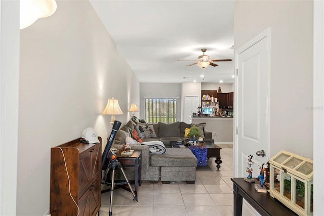 living room with ceiling fan and light tile patterned floors