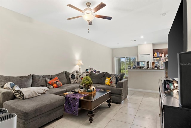 living room featuring light tile patterned floors and ceiling fan