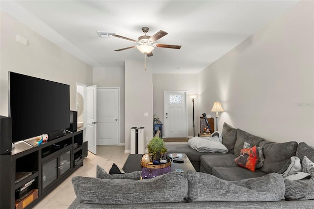 tiled living room featuring ceiling fan