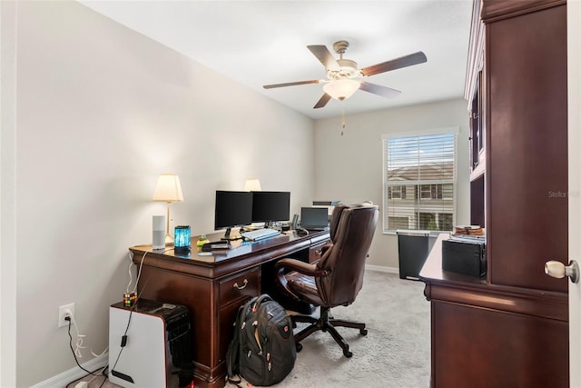 carpeted office with ceiling fan