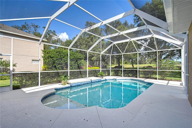 view of swimming pool with a lanai and a patio area