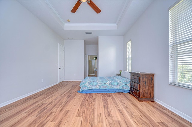 unfurnished bedroom featuring ceiling fan, light hardwood / wood-style flooring, and crown molding