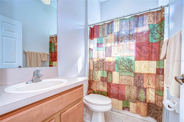 bathroom with tile patterned flooring, curtained shower, vanity, and toilet