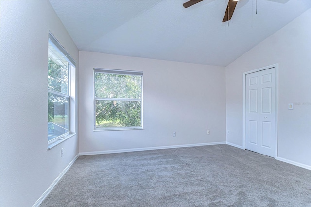 unfurnished room with lofted ceiling, carpet, and ceiling fan