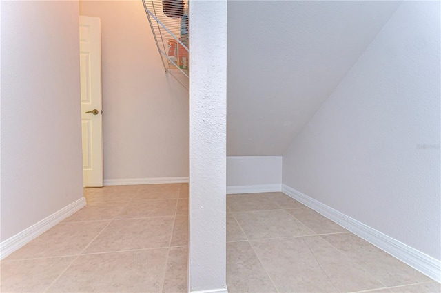 additional living space with light tile patterned flooring