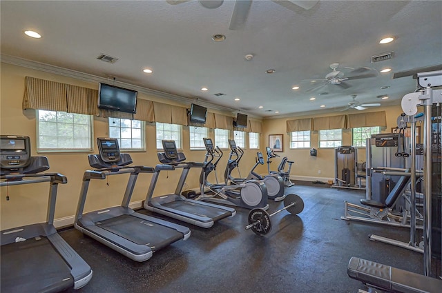 exercise room with a textured ceiling, ceiling fan, and crown molding