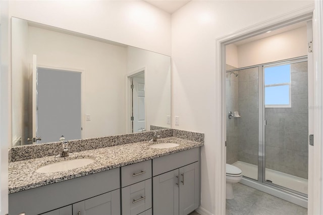 bathroom featuring walk in shower, vanity, and toilet