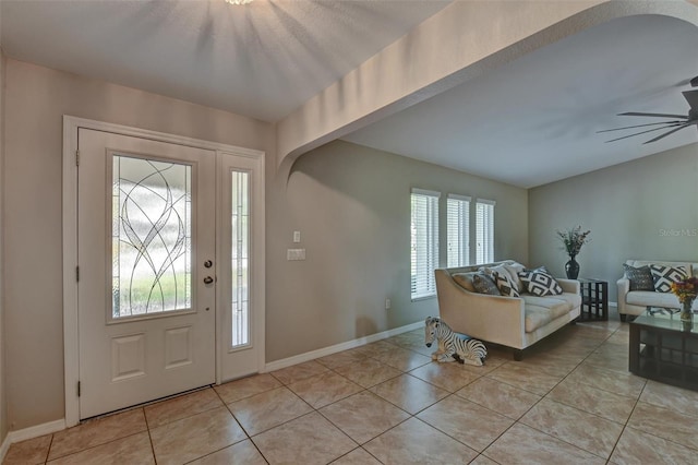 entryway with ceiling fan and light tile patterned floors