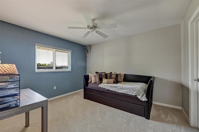 bedroom with light carpet and ceiling fan