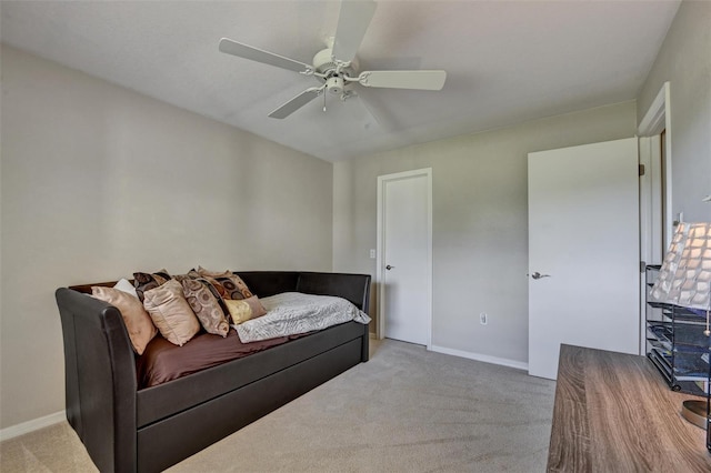 living room with light colored carpet and ceiling fan