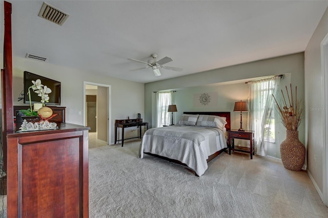 bedroom featuring ceiling fan and light carpet