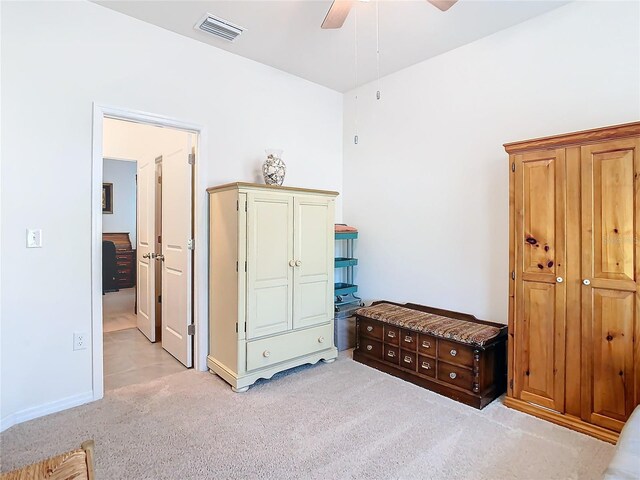 carpeted bedroom with ceiling fan