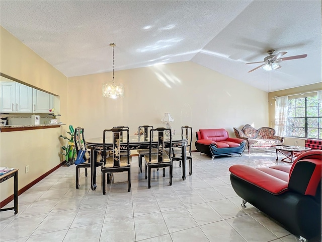 dining room with ceiling fan with notable chandelier, light tile patterned flooring, lofted ceiling, and a textured ceiling