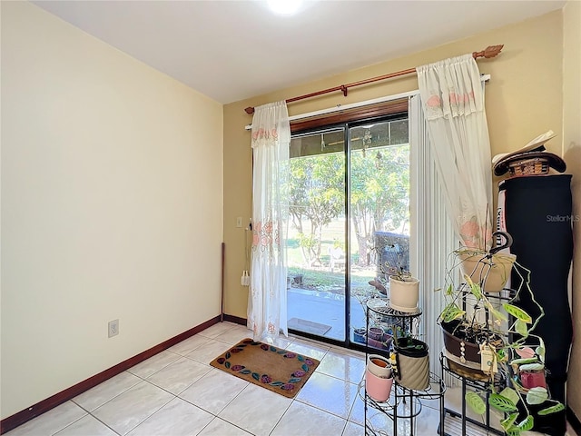 doorway with light tile patterned floors