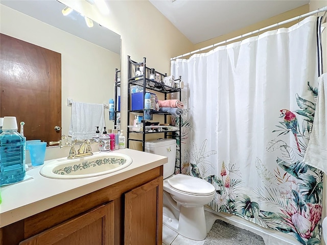 bathroom with tile patterned floors, vanity, and toilet