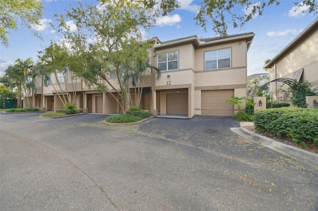 townhome / multi-family property featuring a garage