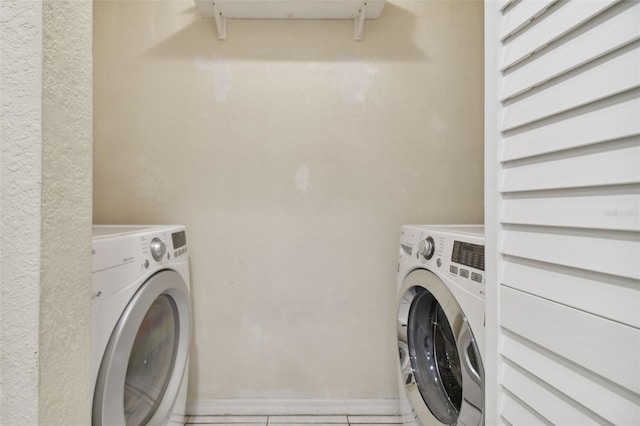 clothes washing area with washer and dryer