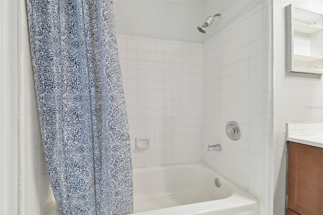 bathroom featuring vanity and shower / tub combo