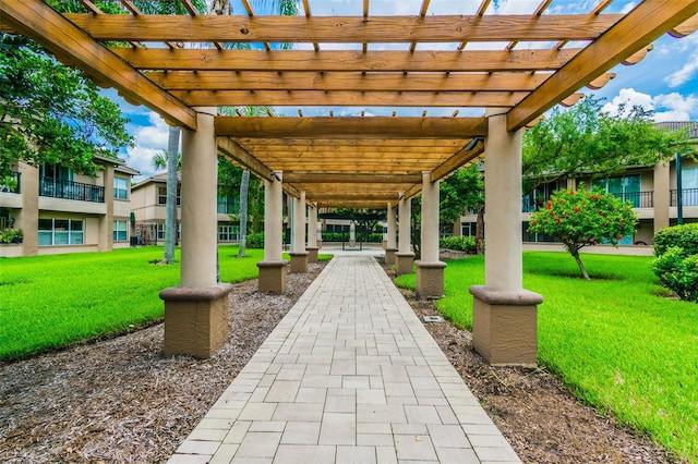 view of patio / terrace featuring a pergola and a balcony