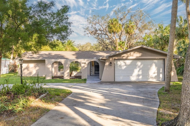 single story home featuring a garage