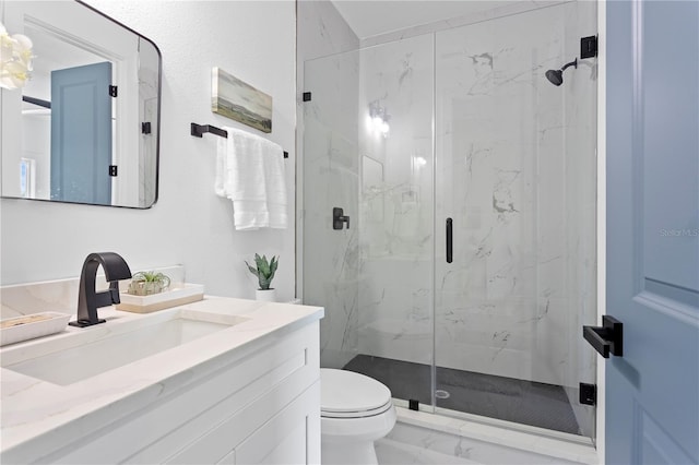 full bathroom with a marble finish shower, vanity, toilet, and marble finish floor